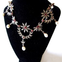 An 18ct.gold diamond, ruby and pearl set fringe necklace.Hammer:  £1150