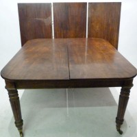 A William  IV figured mahogany pull out extending dining table. Hammer: £3200