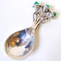 A small silver caddy spoon by Omar Ramsden. Hammer:  £3500