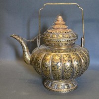 A Late 19th To Early 20th Century Teapot Of Lobed Form with an all over foliate design, 19cm tall Hammer: £7,000